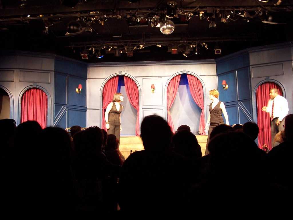 Actors perform on Chicago's Second City stage